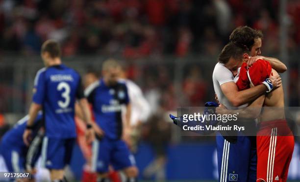 Ivica Olic of Bayern hugs Joris Mathijsen of Hamburg after the Bundesliga match between FC Bayern Muenchen and Hamburger SV at Allianz Arena on...