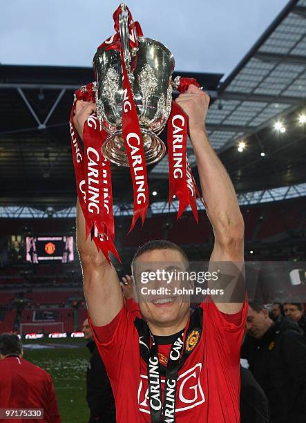 Nemanja Vidic of Manchester United poses with the Carling Cup trophy after the Carling Cup Final match between Aston Villa and Manchester United at...