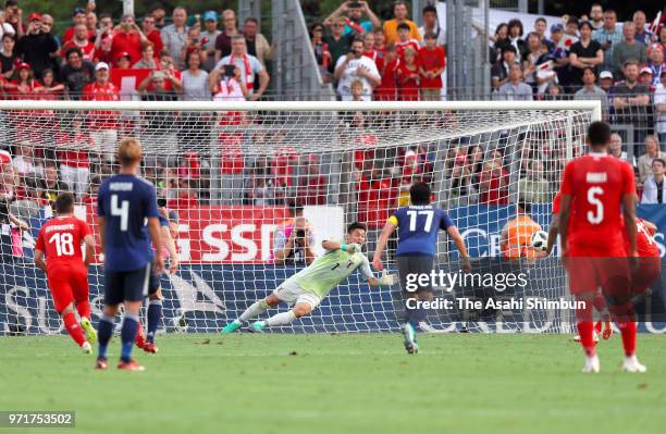 Ricardo Rodriguez of Switzerland converts the penalty to score the opening goal during the international friendly match between Switzerland and Japan...