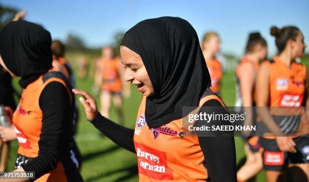 In this photo taken on May 5, 2018 shows girls playing Aussie Rules football known as Australian Football League in Lekemba in the western district...