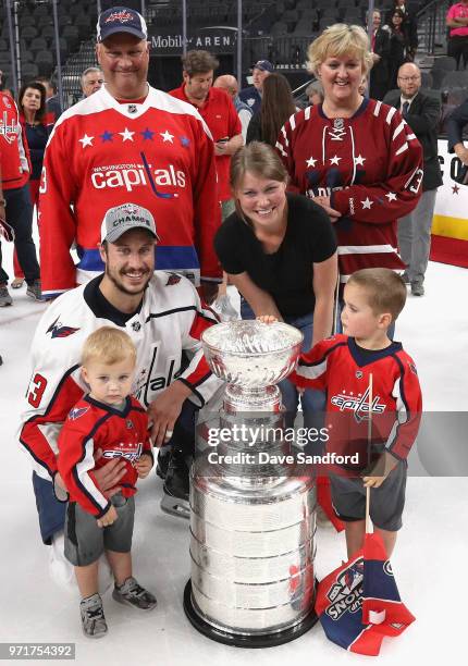 Jay Beagle of the Washington Capitals and his family pose around the Stanley Cup after the Capitals defeated the Vegas Golden Knights 4-3 in Game...