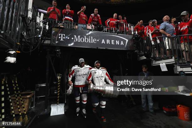 Alex Ovechkin of the Washington Capitals carries the Stanley Cup next to teammates Tom Wilson after their team defeated the Vegas Golden Knights 4-3...