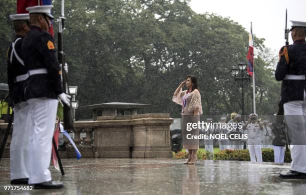 Philippine Vice President Leni Robredo salutes to the statue of National Hero Jose Rizal during a wreath laying ceremony at the 120th Independence...