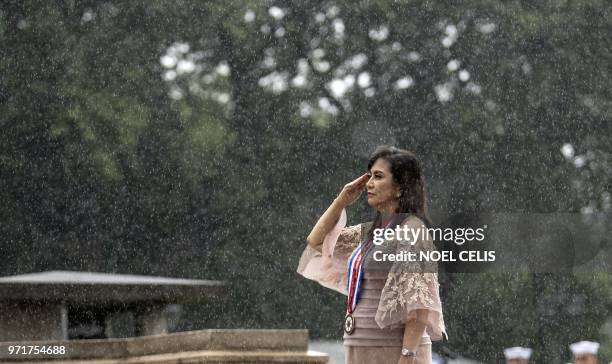 Philippine Vice President Leni Robredo salutes to the statue of National Hero Jose Rizal during a wreath laying ceremony at the 120th Independence...