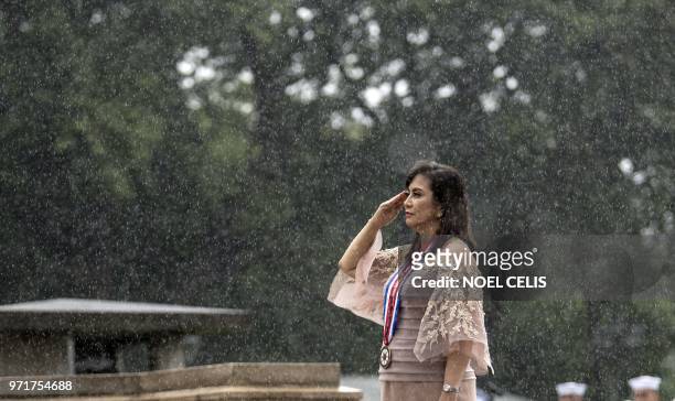 Philippine Vice President Leni Robredo salutes to the statue of National Hero Jose Rizal during a wreath laying ceremony at the 120th Independence...