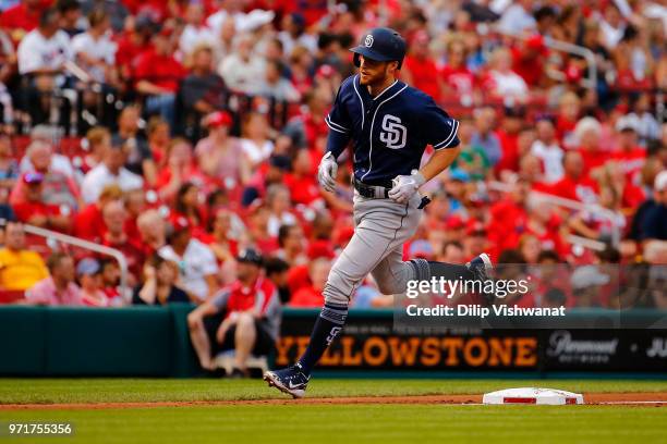 Cory Spangenberg of the San Diego Padres rounds the bases after hitting a home run against the St. Louis Cardinals in the second inning at Busch...