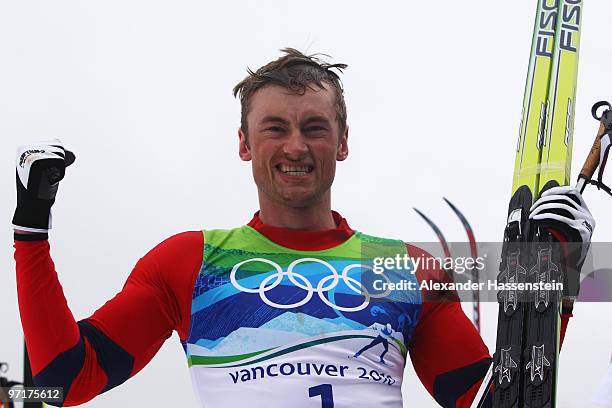 Petter Northug of Norway celebrates winning the gold medal during the Men's 50 km Mass Start Classic cross-country skiing on day 17 of the 2010...