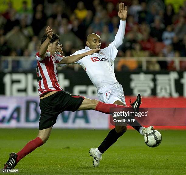 Sevilla's Malian forward Frederic Kanoute vies for the ball with Athletic Bilbao's defender Mikel San Jose during a Spanish league football match at...