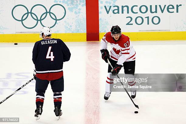 Sidney Crosby of Canada and Tim Gleason of the United States warm up prior to the start of the ice hockey men's gold medal game between USA and...