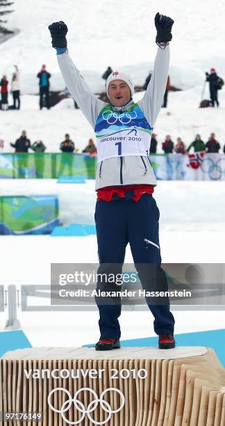 Petter Northug of Norway celebrates winning the gold medal during the Men's 50 km Mass Start Classic cross-country skiing on day 17 of the 2010...