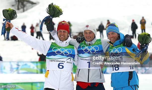 Petter Northug of Norway celebrates winning the gold medal with silver medalist Axel Teichmann of Germany and bronze medalist Johan Olsson of Sweden...