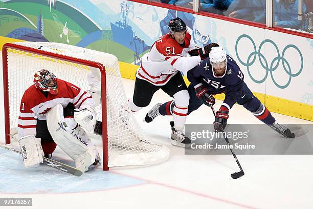 Ryan Malone of the United States is challenged by Ryan Getzlaf of Canada during the ice hockey men's gold medal game between USA and Canada on day 17...