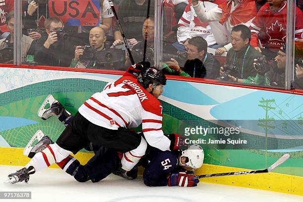 Bobby Ryan of the United States is checked by Brent Seabrook of Canada during the ice hockey men's gold medal game between USA and Canada on day 17...