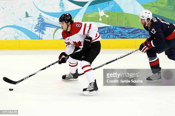 Drew Doughty of Canada is pursued by Ryan Malone of the United States during the ice hockey men's gold medal game between USA and Canada on day 17 of...