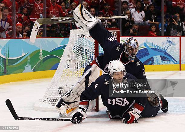 Tim Gleason of and Ryan Miller of the United States defend their goal during the ice hockey men's gold medal game between USA and Canada on day 17 of...