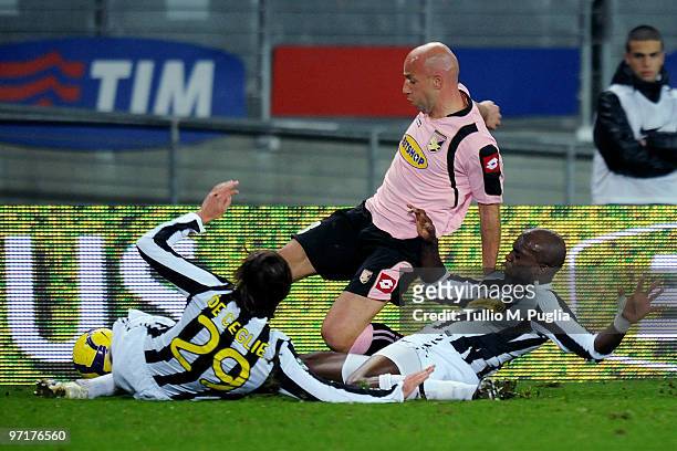 Giulio Migliaccio of Palermo is challenged by Paolo De Ceglie and Mohammed Sissoko of Juventus during the Serie A match between Juventus and Palermo...
