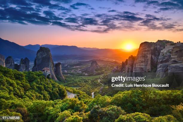 meteora & sunset - meteora greece stock pictures, royalty-free photos & images