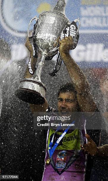 Cameron Smith of Melbourne Storm poses with the World Club Challenge Cup after winning the match between Leeds Rhinos and Melbourne Storm at Elland...