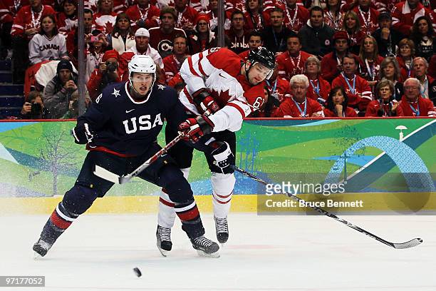 Erik Johnson of the United States is challenged by Rick Nash of Canada during the ice hockey men's gold medal game between USA and Canada on day 17...