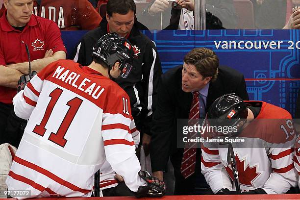 Head coach Mike Babcock talks with Patrick Marleau on the bench during the ice hockey men's gold medal game between USA and Canada on day 17 of the...