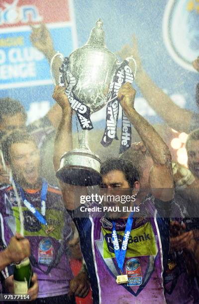 Melbourne Storm captain Cooper Cronk celebrates beating Leeds Rhinos in the Rugby League World Club Challenge at Elland Road, in Leeds, northern...