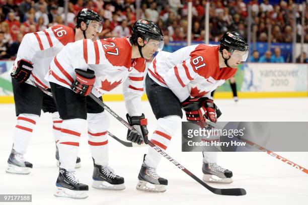Jonathan Toews, Scott Niedermayer and Rick Nash of Canada await a face off during the ice hockey men's gold medal game between USA and Canada on day...