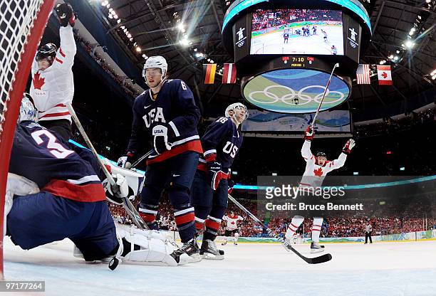 Ryan Miller of the United States is beaten by the shot from Jonathan Toews of Canada for the opening goal during the ice hockey men's gold medal game...