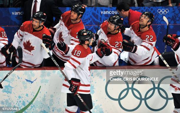 Canadian forward Michael Richards celebrates a goal at the bench during the Men's Gold Medal Hockey match between USA and Canada at the Canada Hockey...