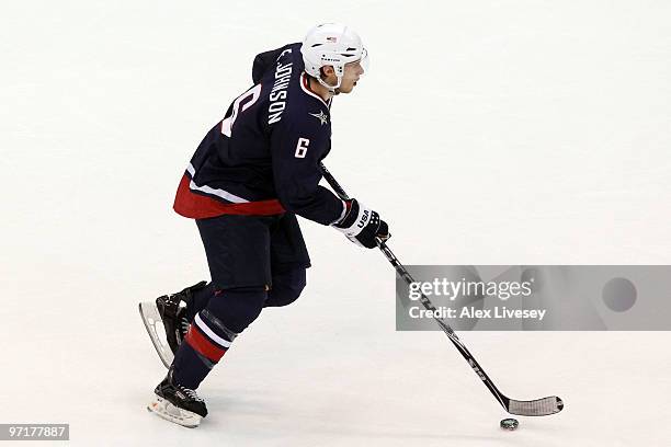 Erik Johnson of the United States handles the puck during the ice hockey men's gold medal game between USA and Canada on day 17 of the Vancouver 2010...