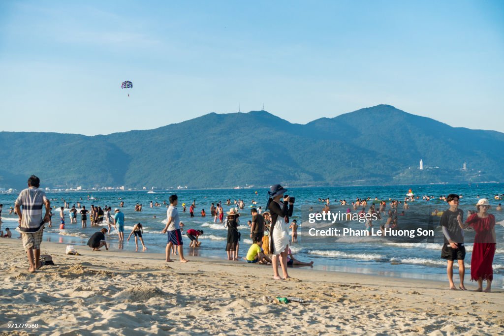 Real People enjoying their happy summer day on My Khe beach of Da nang, Vietnam