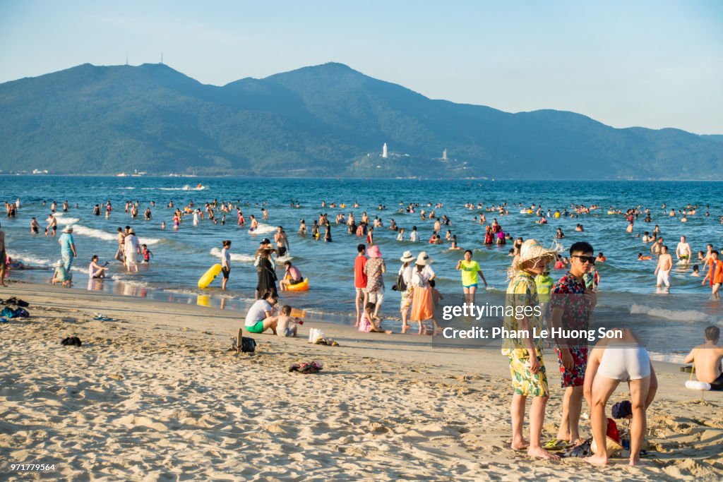 Real People enjoying their happy summer day on My Khe beach of Da nang, Vietnam
