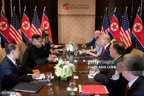 President Donald Trump and North Korea's leader Kim Jong Un sit down with their respective delegations for the US-North Korea summit, at the Capella...