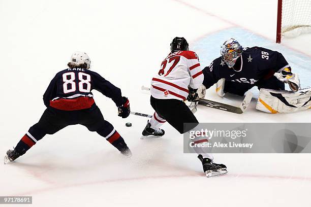 Patrick Kane of the United States gets in the way of the shot of Sidney Crosby of Canada as Ryan Miller tends goal during the ice hockey men's gold...