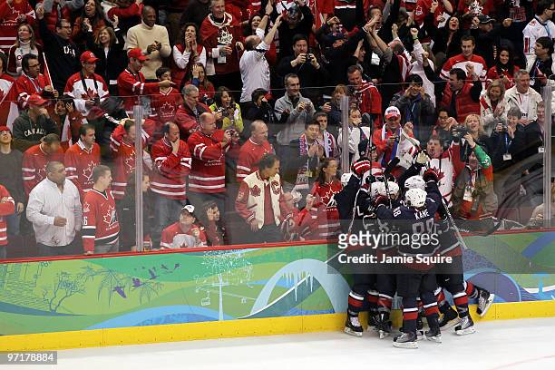 Team USA celebrate after teammate Zach Parise of the United States scores a goal to tie the scores 2-2 late in the third during the ice hockey men's...