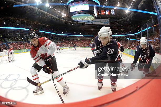 Ryan Getzlaf of Canada and Paul Stastny of the United States battle for the puck during the ice hockey men's gold medal game between USA and Canada...