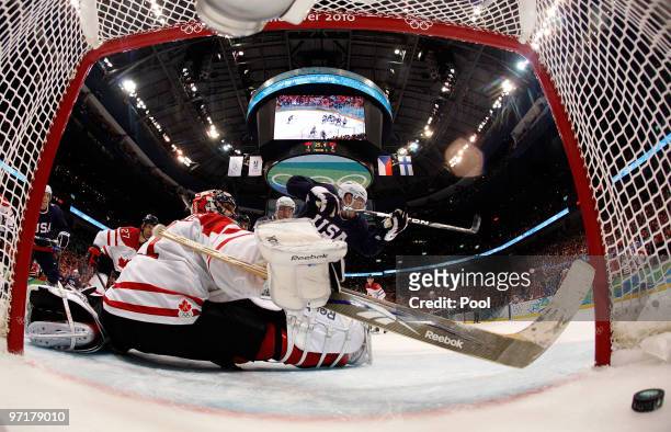 Zach Parise of the United States celebrates after scoring a goal past Roberto Luongo of Canada to tie the scores 2-2 late in the third during the ice...
