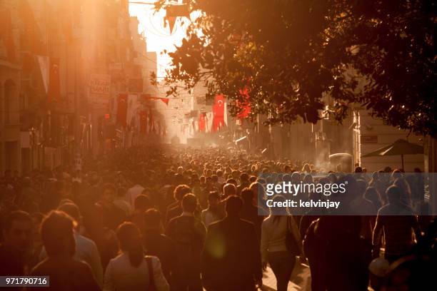 crowds of shoppers on istiklal avenue in the centre of istanbul, turkey - kelvinjay stock pictures, royalty-free photos & images