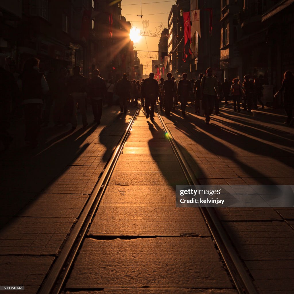 Crowds of shoppers and a tram on Istiklal Avenue in Istanbul, Turkey