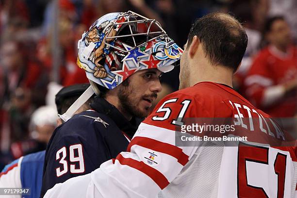 Ryan Getzlaf of Canada speaks with goalkeeper Ryan Miller of the United States following Canada's 3-2 overtime victory during the ice hockey men's...