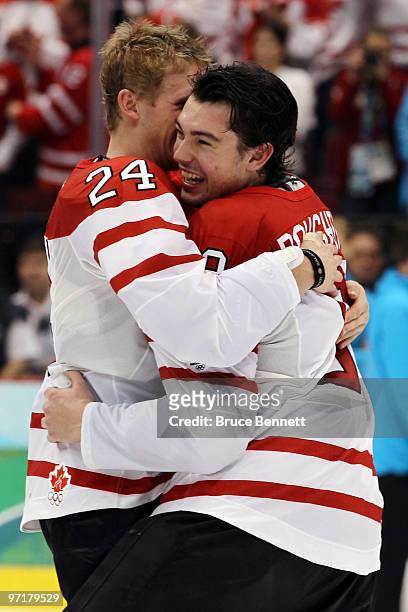 Corey Perry and Drew Doughty of Canada celebrate after winning the gold medal during the ice hockey men's gold medal game between USA and Canada on...