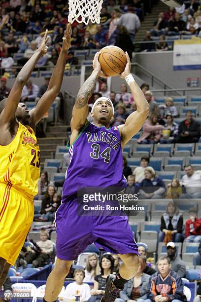 James Jackson of the Dakota Wizards shoots over Anthony Kent of the Fort Wayne Mad Ants at Allen County Memorial Coliseum on February 28, 2010 in...