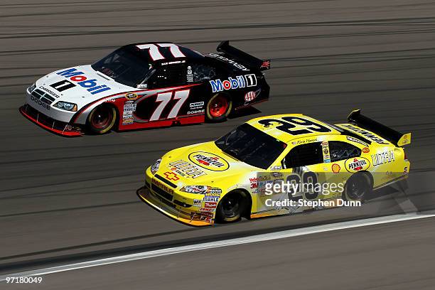 Kevin Harvick, driver of the Pennzoil Ultra Chevrolet, races Sam Hornish Jr., driver of the Mobil 1 Dodge, during the NASCAR Sprint Cup Series Shelby...