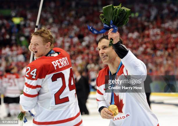 Scott Niedermayer and Corey Perry of Canada celebrate after winning the godl medal in the ice hockey men's gold medal game between USA and Canada on...