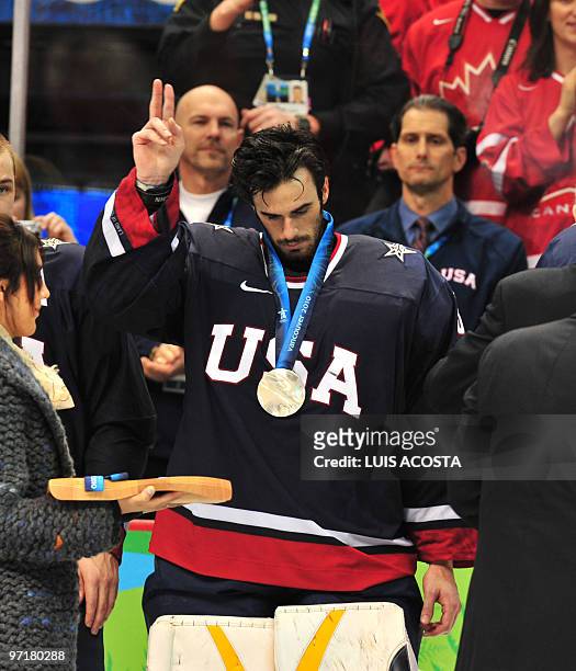 Ryan Miller of the US reacts after defeat by Canada in the men's gold medal Ice Hockey match at Canada Hockey Place during the Vancouver Winter...