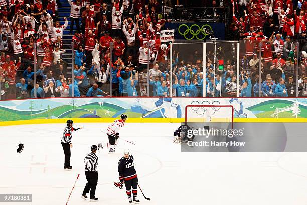 Ryan Miller of the United States reacts after giving up the game winning goal in overtime to Sidney Crosby of Canada during the ice hockey men's gold...