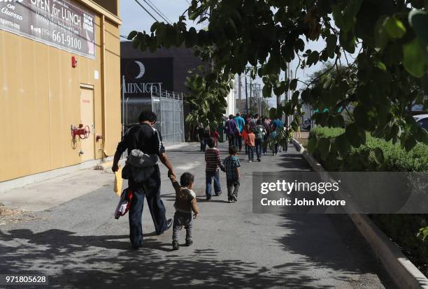 Central American immigrant families depart ICE custody, pending future immigration court hearings on June 11, 2018 in McAllen, Texas. Thousands of...