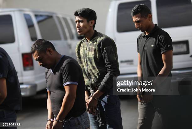 Undocumented immigrants leave a U.S. Federal court in shackles on June 11, 2018 in McAllen, Texas. Thousands of migrants continue to cross into the...