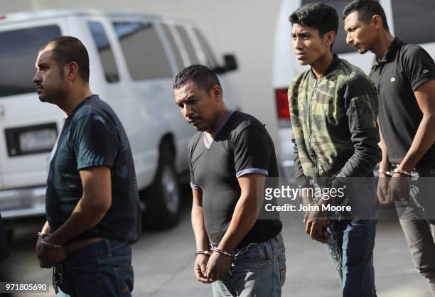 Undocumented immigrants leave a U.S. Federal court in shackles on June 11, 2018 in McAllen, Texas. Thousands of migrants continue to cross into the...