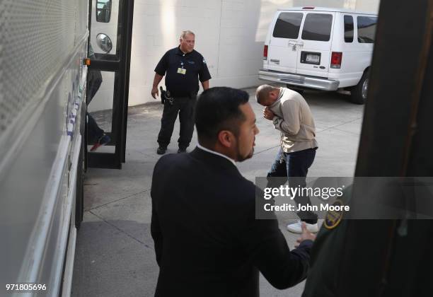 Undocumented immigrants leave a U.S. Federal court in shackles on June 11, 2018 in McAllen, Texas. Thousands of migrants continue to cross into the...