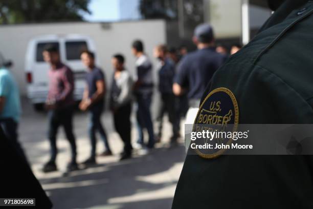 Undocumented immigrants leave a U.S. Federal court in shackles on June 11, 2018 in McAllen, Texas. Thousands of migrants continue to cross into the...